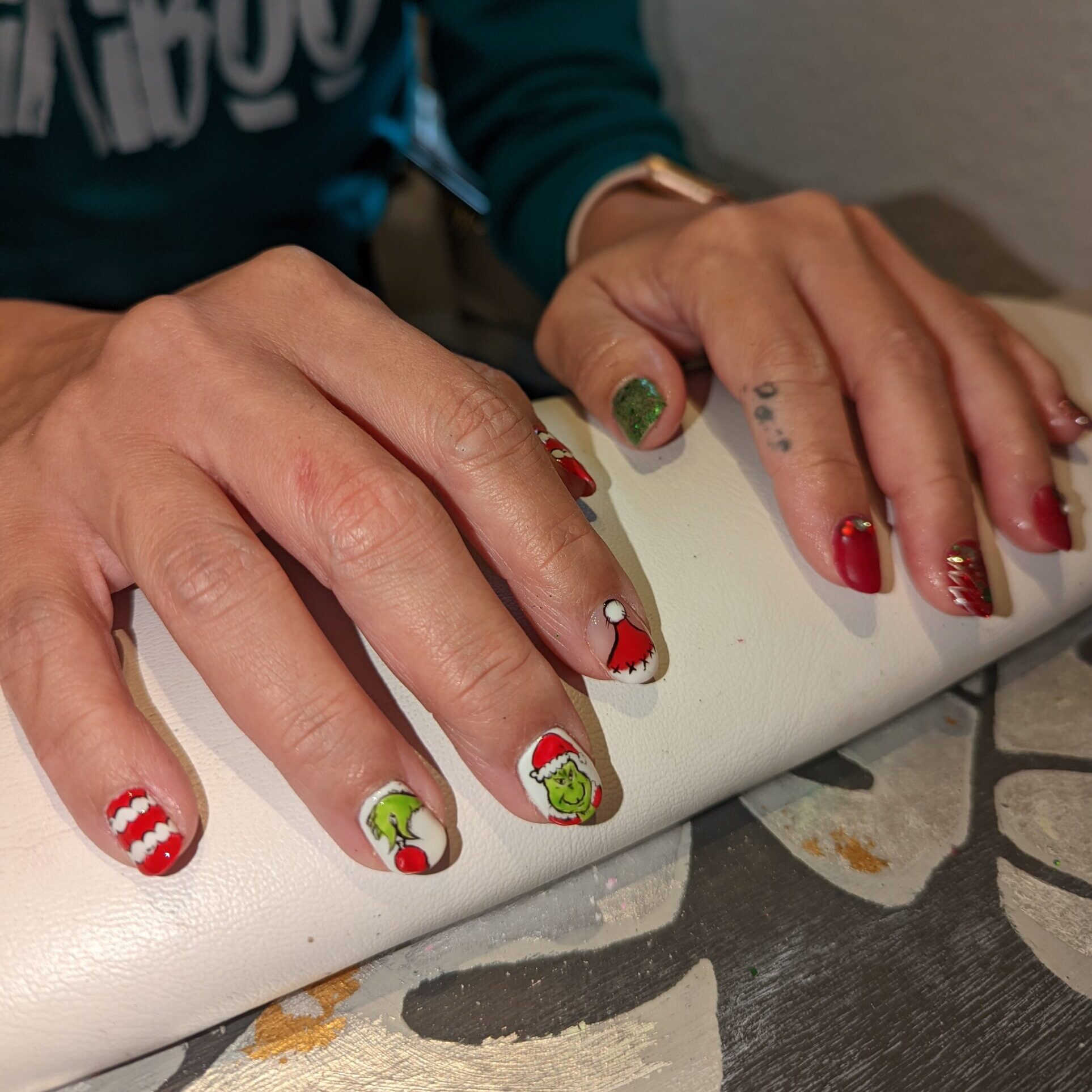 Hand painted Grinch character gel nails