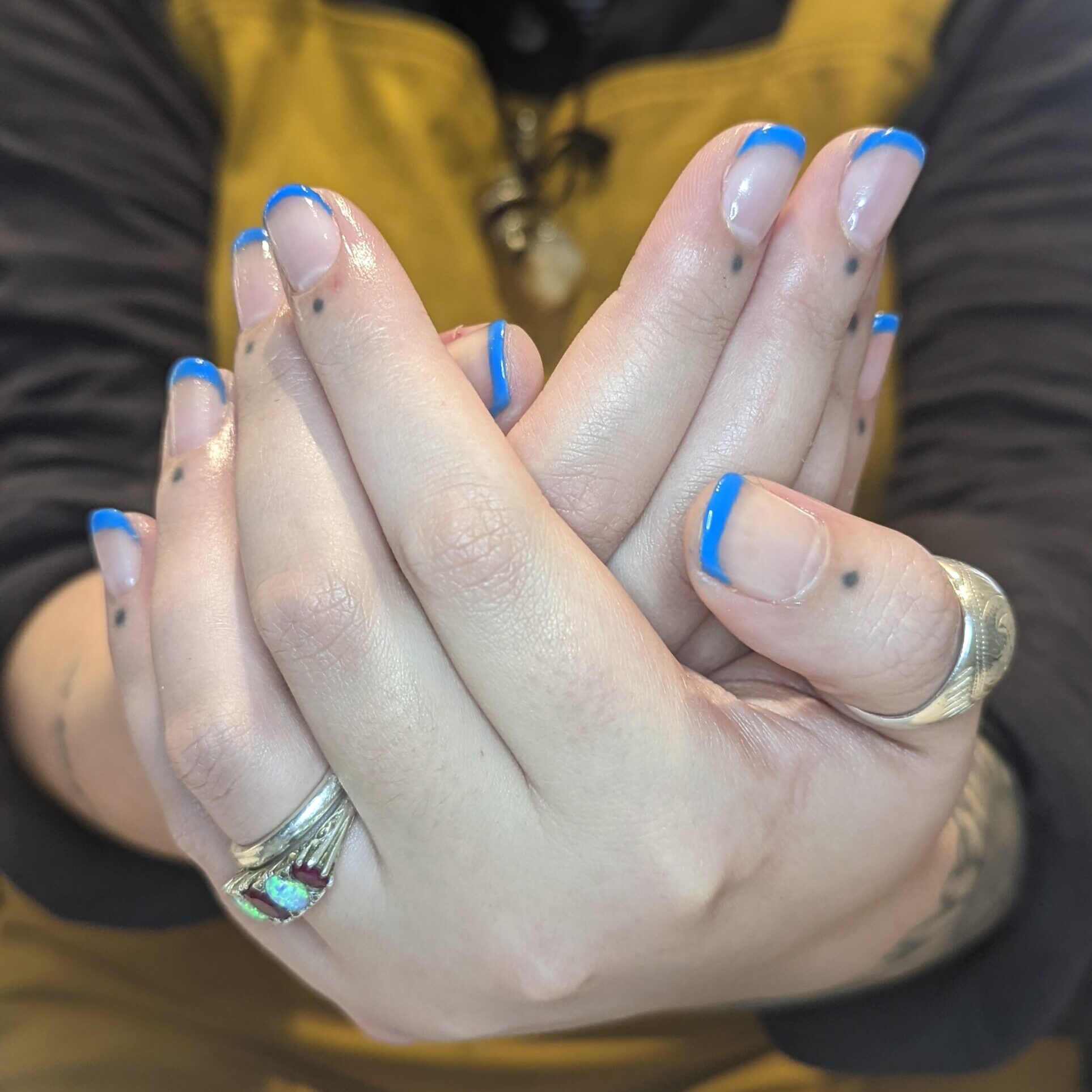 Nude nails with bright blue painted tips. Ginger Harmony - Nourishing vegan beauty in the heart of Oakham