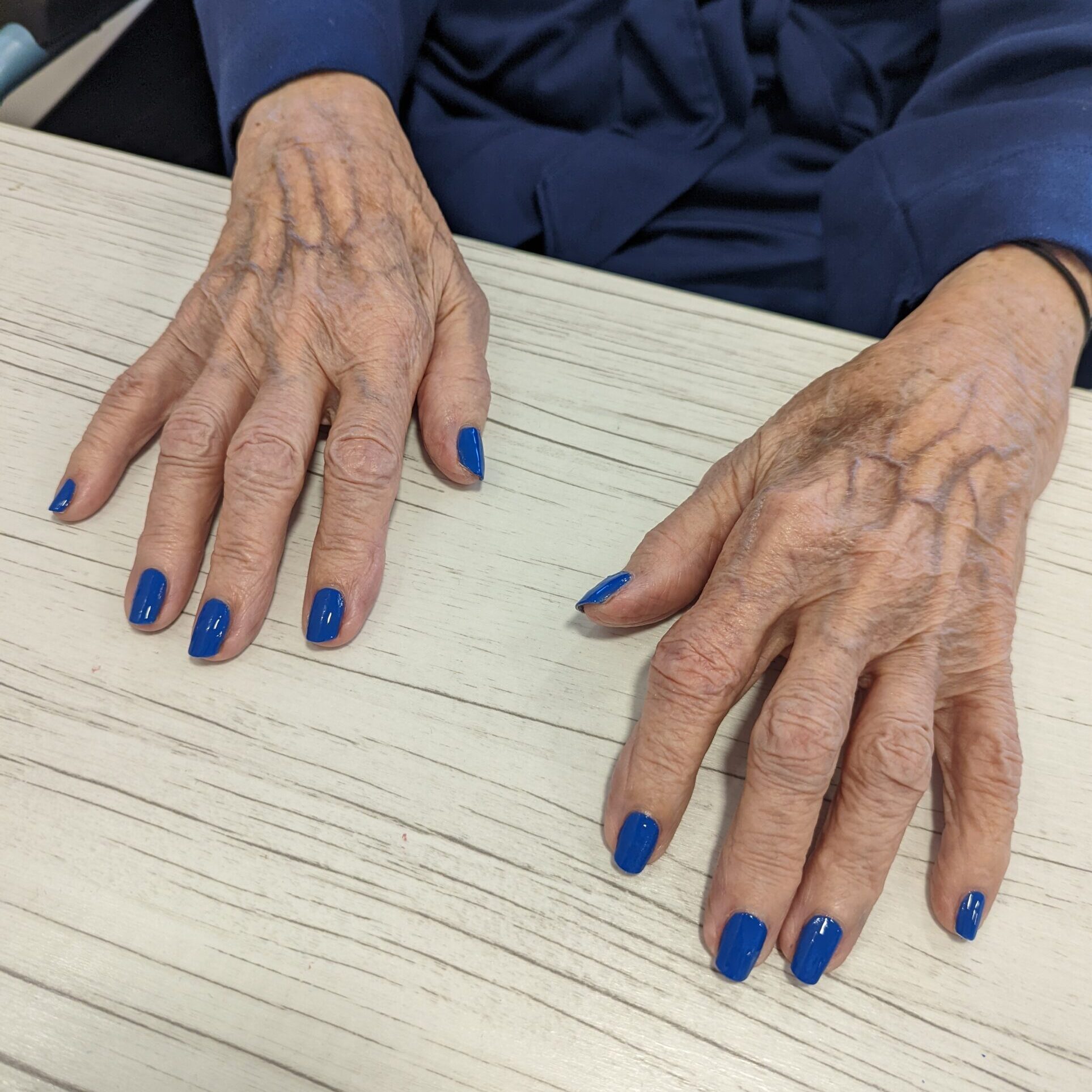 Blue nail polish over natural nails